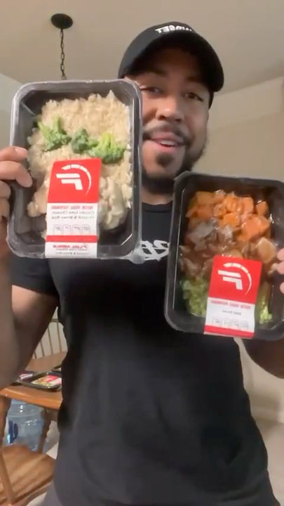 man holding Fuel Meals packages
