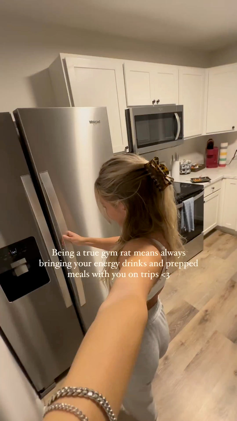 woman opening fridge